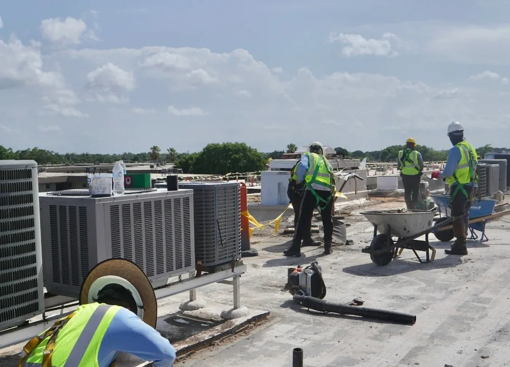 SCI Roofing crew working on a commercial flat roof in South Florida